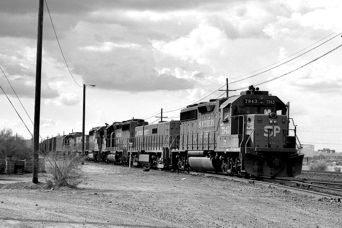 SP 7943 is a class EMD GP40-2 and  is pictured in Tucson, Arizona, USA.  This was taken along the Nogales/SP on the Southern Pacific Transportation Company. Photo Copyright: Rick Doughty uploaded to Railroad Gallery on 04/12/2024. This photograph of SP 7943 was taken on Sunday, August 12, 1984. All Rights Reserved. 